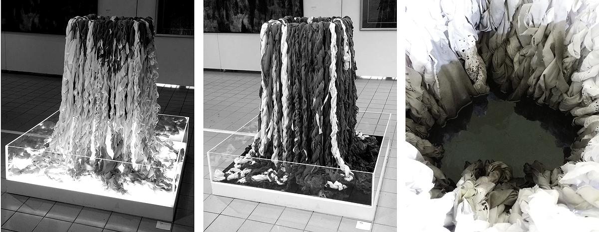 〈黑滲透〉，2015，純棉布、半棉布、尼龍仿棉布、墨汁、水、透明壓克力、LED燈、白木箱，120×120×150 cm。的封面圖